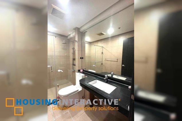 semi-furnished 2br unit with parking for rent in one serendra