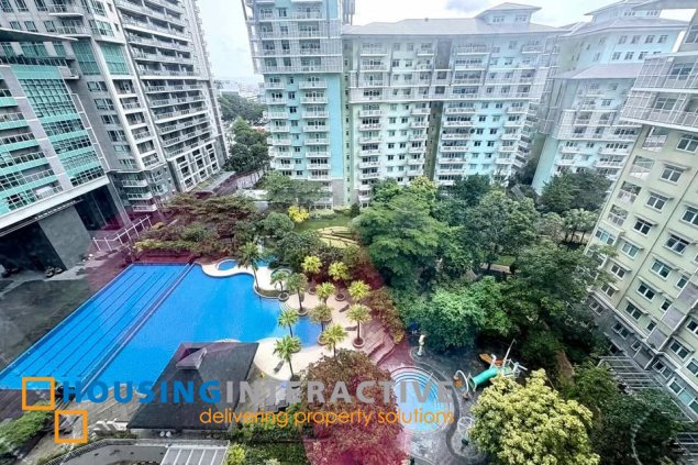 semi-furnished 2br unit with parking for rent in one serendra