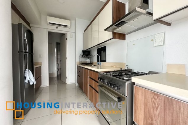fully furnished 2br unit with balcony and parking for sale in arya residences