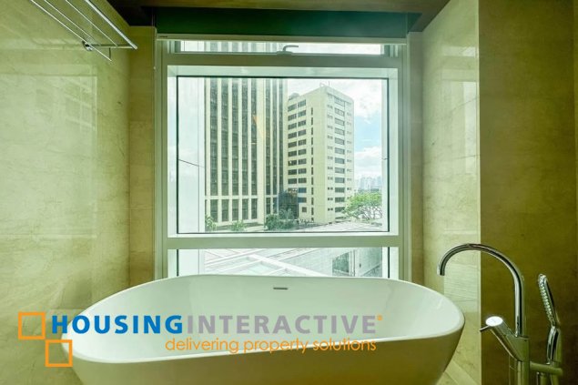 semi-furnished 3br unit with parking for sale in two roxas triangle