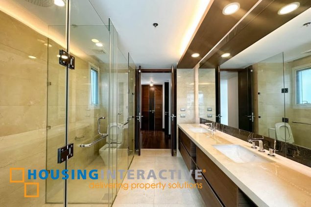 semi-furnished 3br unit with parking for sale in two roxas triangle