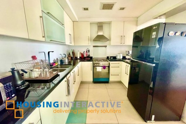 fully furnished 2br unit with balcony and parking for sale in one serendra