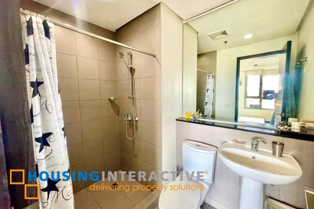 fully furnished 2br unit with balcony and parking for sale in one serendra