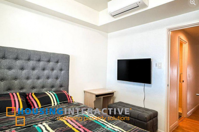 fully furnished 2br unit with parking for sale in one rockwell