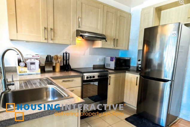 fully furnished 2br unit with parking for sale in one rockwell