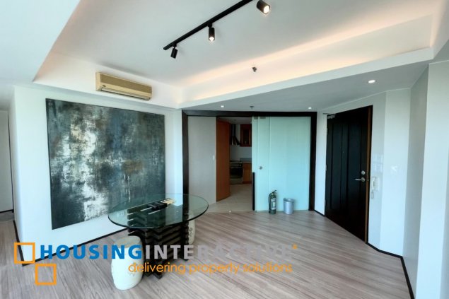semi-furnished 2br unit with parking for lease in bonifacio ridge