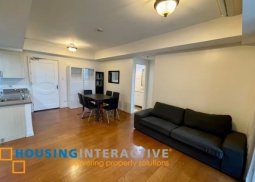 fully furnished 2br unit with parking for sale in one rockwell