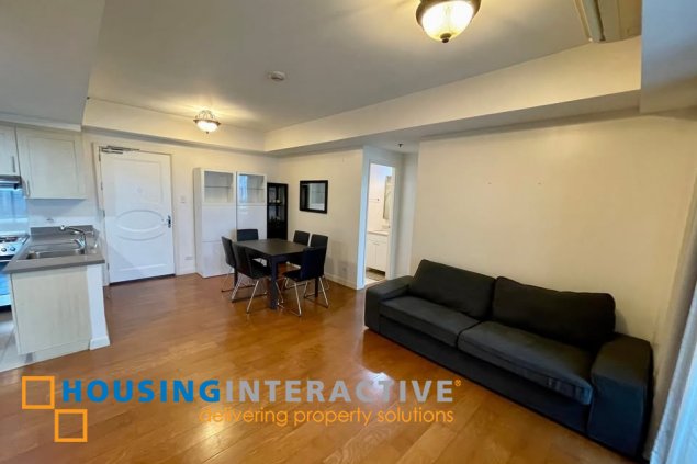 fully furnished 2br unit with parking for sale in one rockwell