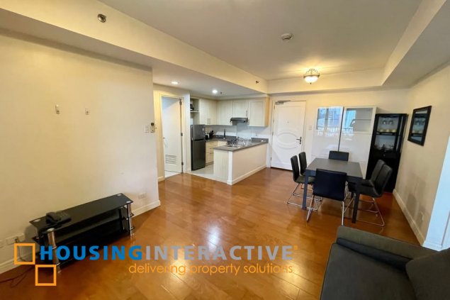 fully furnished 2br unit with parking for sale in one rockwell