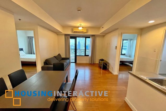 fully furnished 2br unit with parking for sale in one rockwell