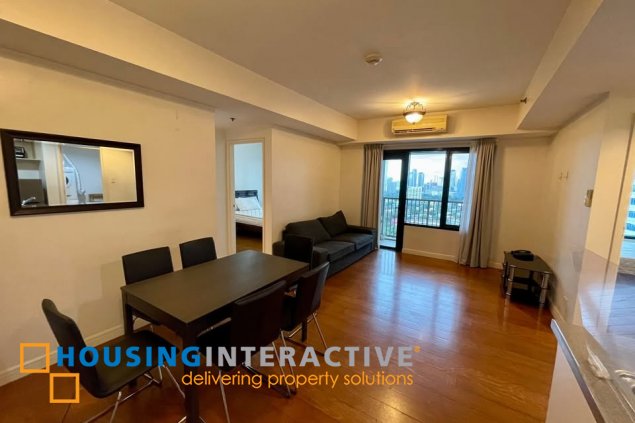 fully furnished 2br unit with parking for sale in one rockwell