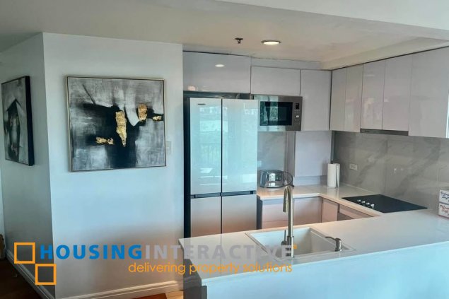 semi-furnished 1br unit with parking for sale in one rockwell