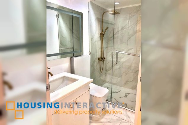 semi-furnished 1br unit with parking for sale in one rockwell