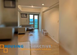 fully furnished 1br unit with parking for sale in the grove by rockwell