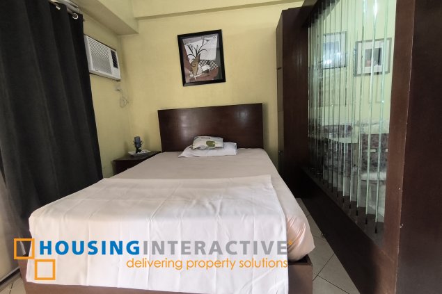 fully-furnished studio unit with partition and parking slot at paseo parkview suites for rush sale