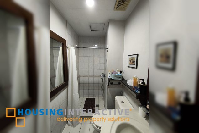 fully-furnished studio unit with partition and parking slot at paseo parkview suites for rush sale