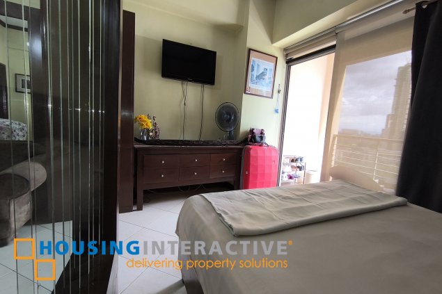 fully-furnished studio unit with partition and parking slot at paseo parkview suites for rush sale