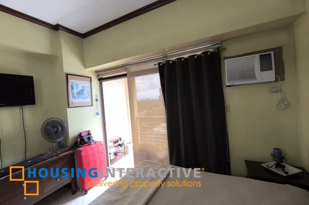 fully-furnished studio unit with partition and parking slot at paseo parkview suites for rush sale