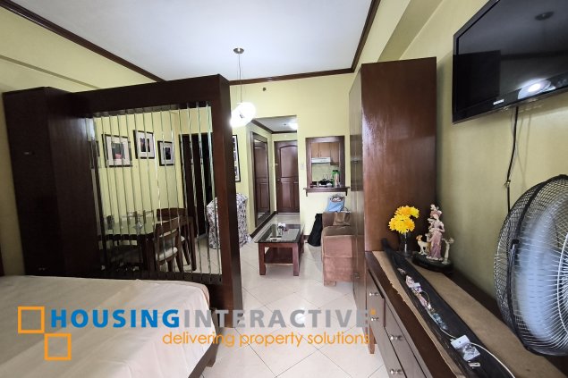 fully-furnished studio unit with partition and parking slot at paseo parkview suites for rush sale