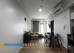 fully-furnished 1 bedroom condo unit with a huge balcony/terrace at solstice towers at circuit makati for sale