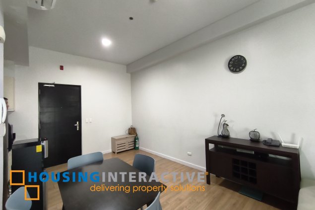 fully-furnished 1 bedroom condo unit with a huge balcony/terrace at solstice towers at circuit makati for sale