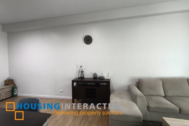 fully-furnished 1 bedroom condo unit with a huge balcony/terrace at solstice towers at circuit makati for sale