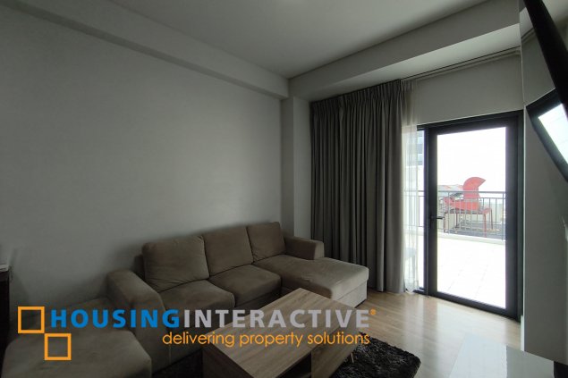 fully-furnished 1 bedroom condo unit with a huge balcony/terrace at solstice towers at circuit makati for sale