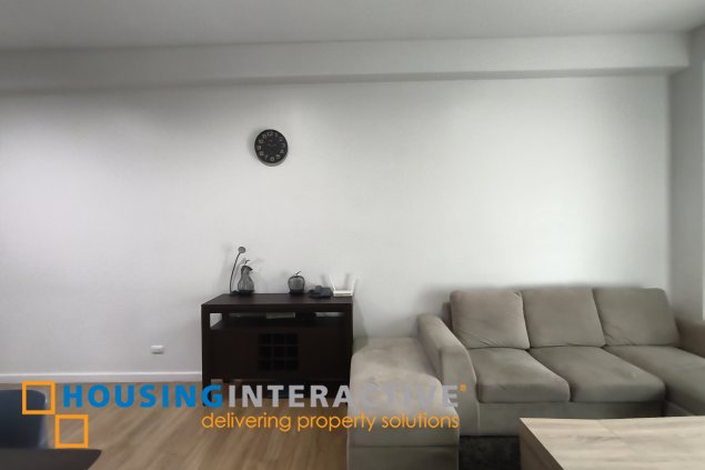 fully-furnished 1 bedroom condo unit with a huge balcony/terrace at solstice towers at circuit makati for sale