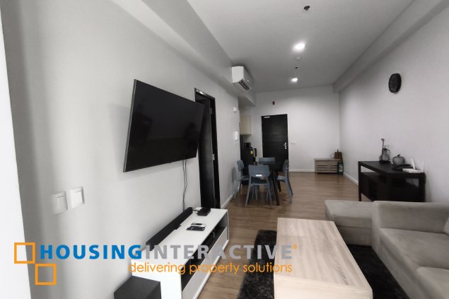 fully-furnished 1 bedroom condo unit with a huge balcony/terrace at solstice towers at circuit makati for sale