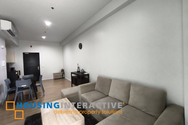 fully-furnished 1 bedroom condo unit with a huge balcony/terrace at solstice towers at circuit makati for sale