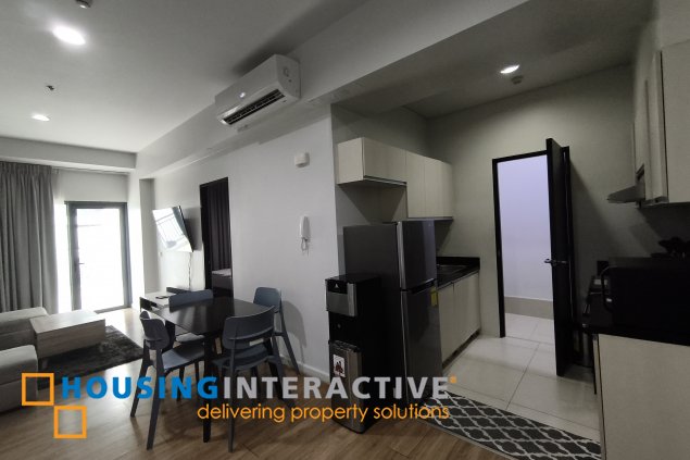 fully-furnished 1 bedroom condo unit with a huge balcony/terrace at solstice towers at circuit makati for sale
