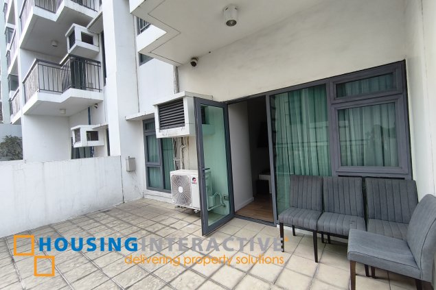 fully-furnished 1 bedroom condo unit with a huge balcony/terrace at solstice towers at circuit makati for sale
