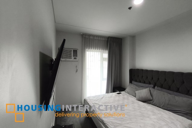 fully-furnished 1 bedroom condo unit with a huge balcony/terrace at solstice towers at circuit makati for sale