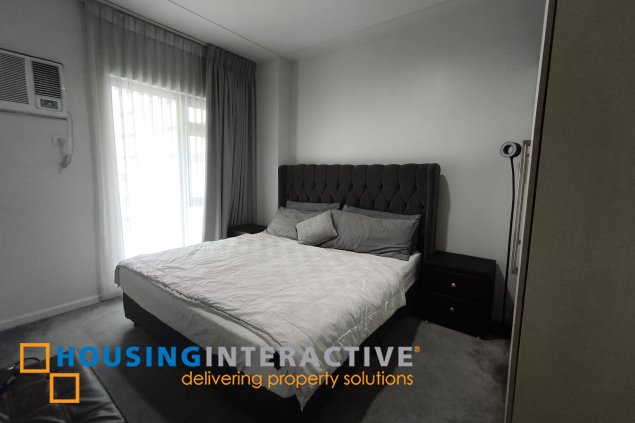 fully-furnished 1 bedroom condo unit with a huge balcony/terrace at solstice towers at circuit makati for sale