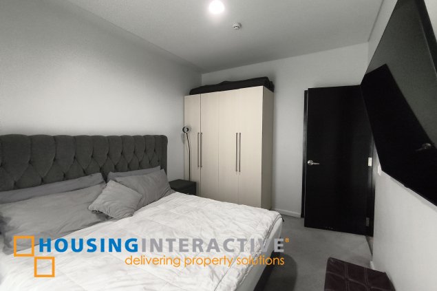 fully-furnished 1 bedroom condo unit with a huge balcony/terrace at solstice towers at circuit makati for sale