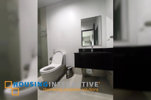 fully-furnished 1 bedroom condo unit with a huge balcony/terrace at solstice towers at circuit makati for sale