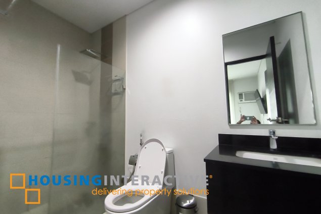 fully-furnished 1 bedroom condo unit with a huge balcony/terrace at solstice towers at circuit makati for sale