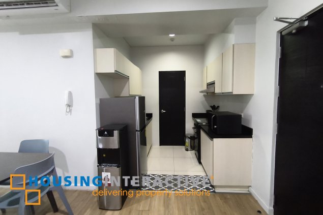 fully-furnished 1 bedroom condo unit with a huge balcony/terrace at solstice towers at circuit makati for sale