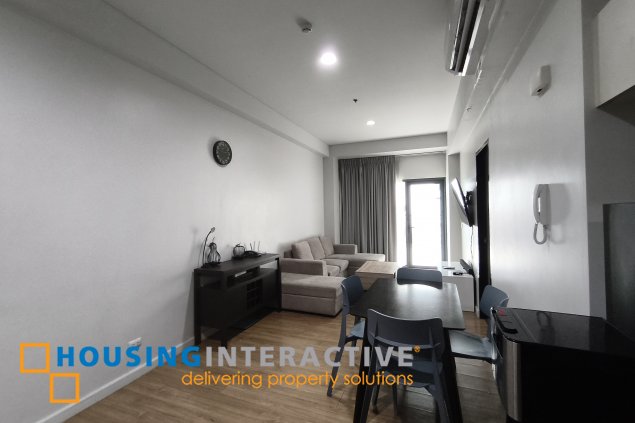 fully-furnished 1 bedroom condo unit with a huge balcony/terrace at solstice towers at circuit makati for sale