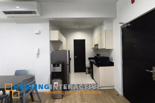 fully-furnished 1 bedroom condo unit with a huge balcony/terrace at solstice towers at circuit makati for sale