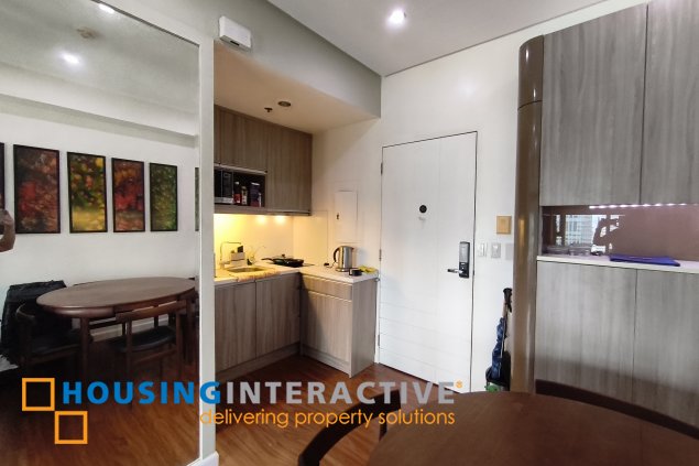 fully-furnished studio unit with parking slot at anaheim tower in the levels by filinvest