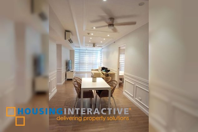 nicely furnished 2br unit with balcony and parking for rent in two serendra