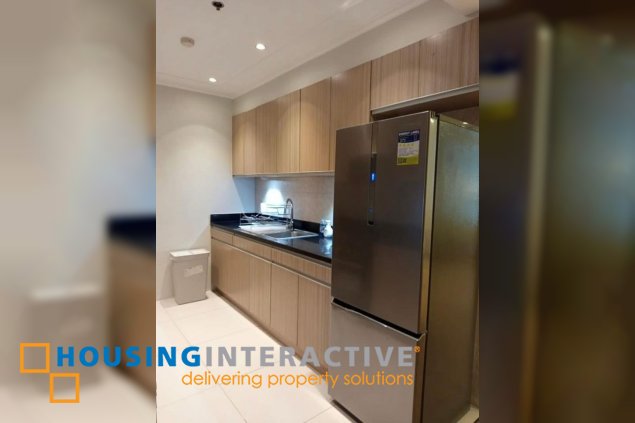 nicely furnished 2br unit with balcony and parking for rent in two serendra