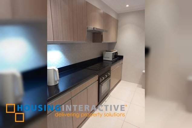 nicely furnished 2br unit with balcony and parking for rent in two serendra