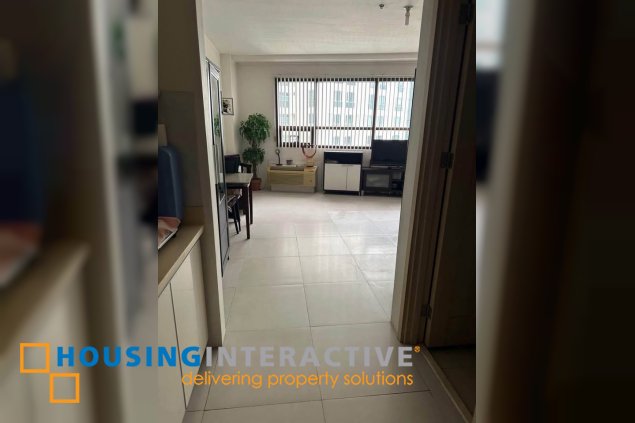semi-furnished studio unit for sale in the icon residences