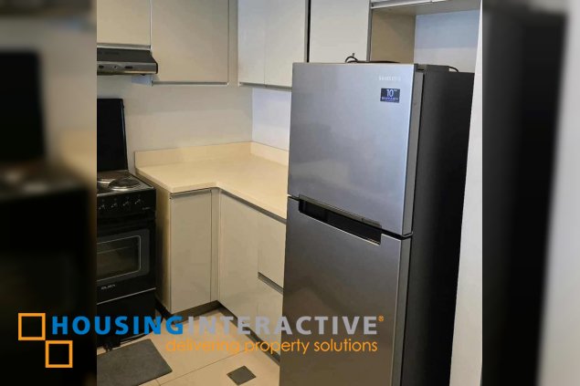 semi-furnished 1br unit with parking for sale in the infinity tower