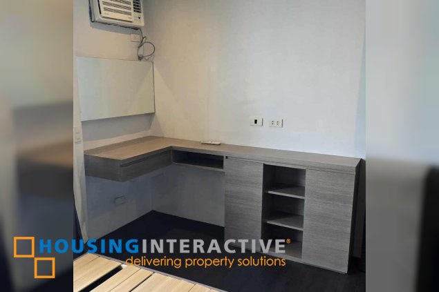 semi-furnished 1br unit with parking for sale in the infinity tower