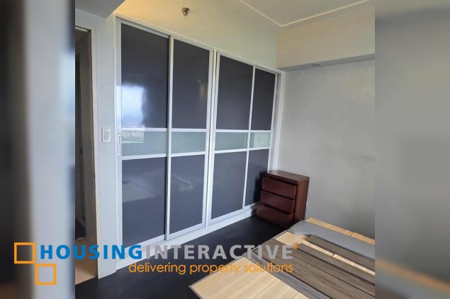 semi-furnished 1br unit with parking for sale in the infinity tower