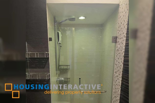 semi-furnished 1br unit with parking for sale in the infinity tower