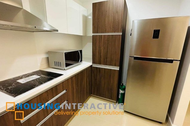 semi furnished 2br with parking for sale